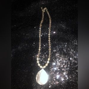 Silver beaded necklace.  With silver pendant.